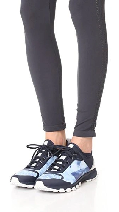 Shop Adidas By Stella Mccartney Adizero Xt Printed Sneakers In Legend Blue/white/purple