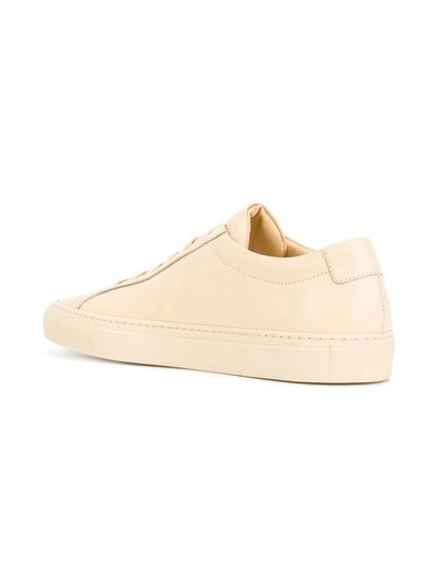 Shop Common Projects Achilles Low Sneakers - Nude & Neutrals