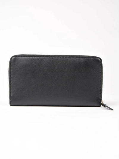 Shop Alexander Mcqueen Insignia Zip Around Wallet In Black
