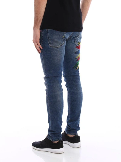 Shop Philipp Plein Twisted Embroidered Jeans In Denim