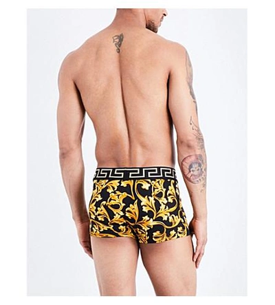 Shop Versace Baroque Low Rise Stretch-jersey Trunks In Black Gold
