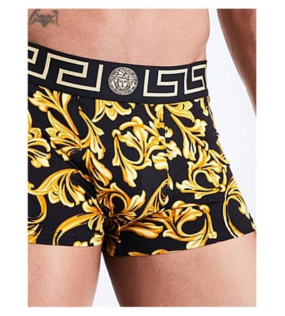 Shop Versace Baroque Low Rise Stretch-jersey Trunks In Black Gold
