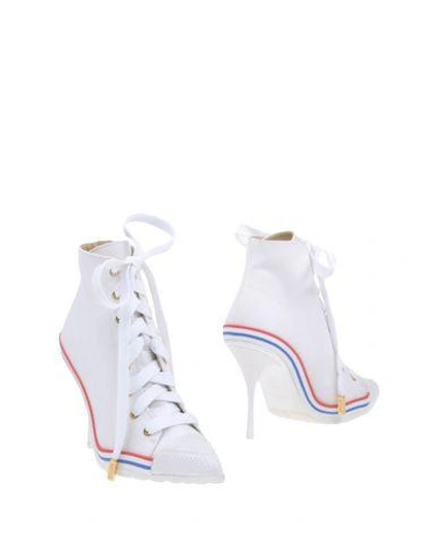 Shop Moschino Ankle Boots In White