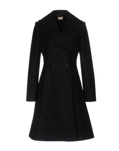 Shop Alaïa Coat In Black
