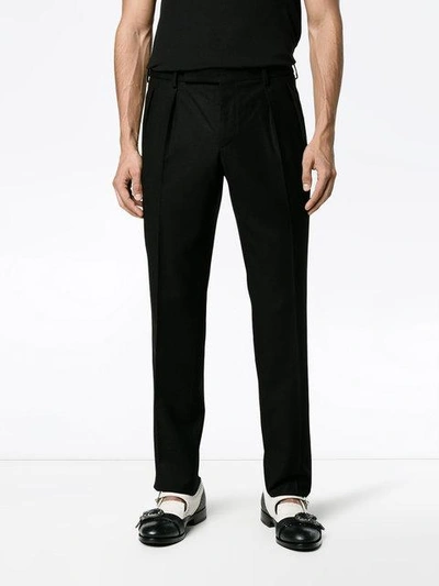Shop Saint Laurent Pleated Trousers In Black