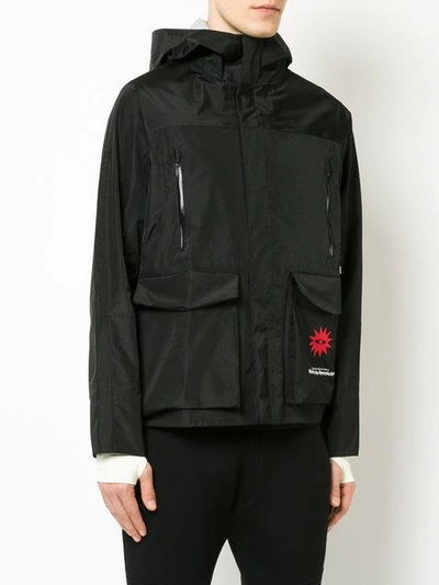 Shop Undercover Revolution Hooded Jacket In Black