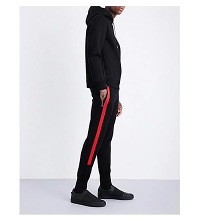 Shop Neil Barrett Contrast-stripe Waffle-knit Low-rise Wool Track Pants In Black Red