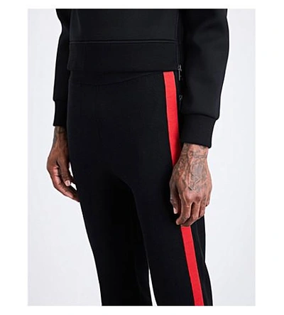 Shop Neil Barrett Contrast-stripe Waffle-knit Low-rise Wool Track Pants In Black Red