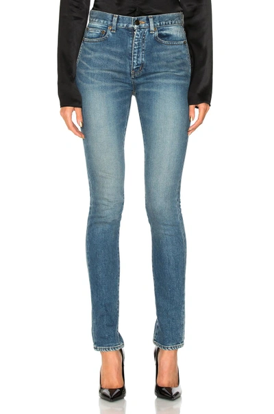 Shop Saint Laurent Medium Rise Jeans In Blue