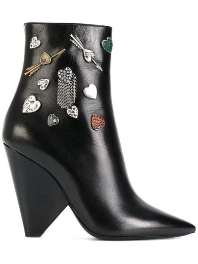 Shop Saint Laurent Embellished Niki 85 Asymmetric Boots - Black
