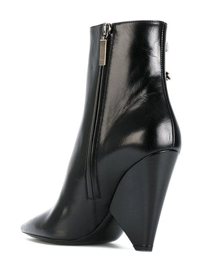 Shop Saint Laurent Embellished Niki 85 Asymmetric Boots - Black