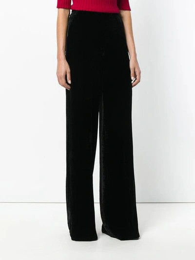 Shop Etro Flared Trousers In Black