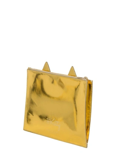 Shop Charlotte Olympia Clutch In Gold