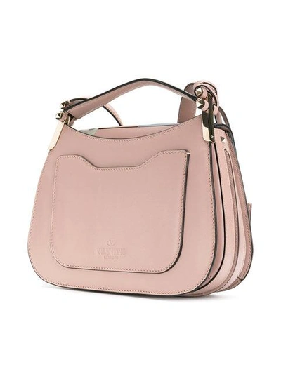 Shop Valentino Garavani Piper Saddle Bag In Pink