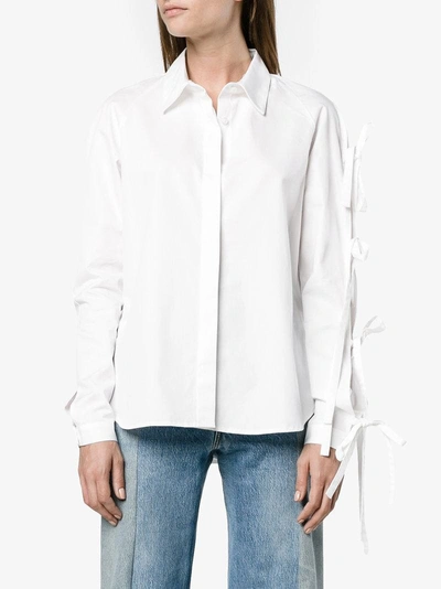 Shop Sandy Liang Noah Long Sleeve Bow Shirt In White