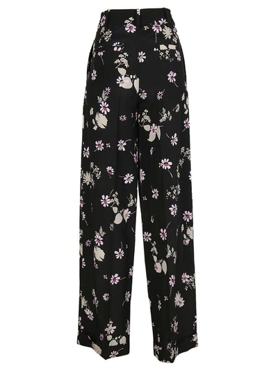 Shop Valentino Wide Leg Floral Print Trousers In Nero