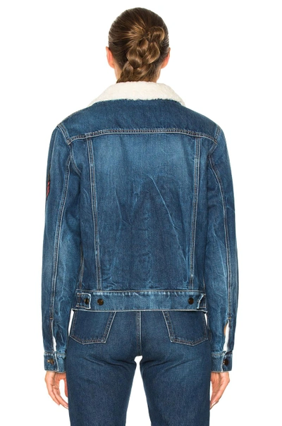 Shop Saint Laurent Shearling Trim Patch Denim Jacket In Blue