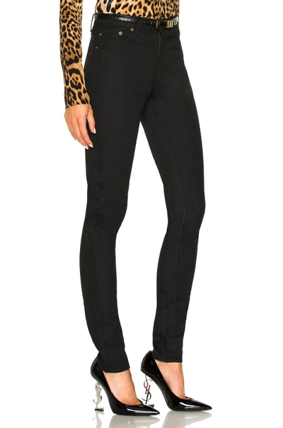 Shop Saint Laurent Medium Rise Skinny Jeans In Black. In Used Black