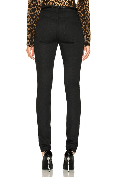 Shop Saint Laurent Medium Rise Skinny Jeans In Black. In Used Black