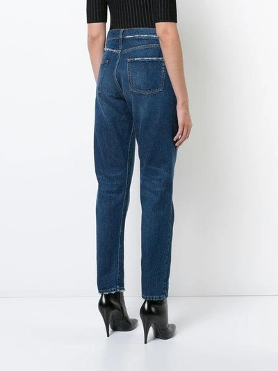 Shop Saint Laurent Distressed Effect Tapered Jeans In Blue