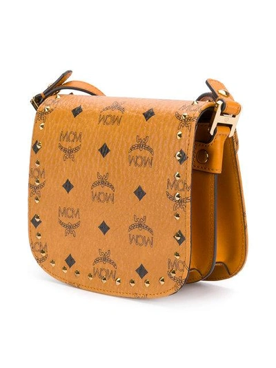Shop Mcm Studded Saddle Crossbody Bag - Brown