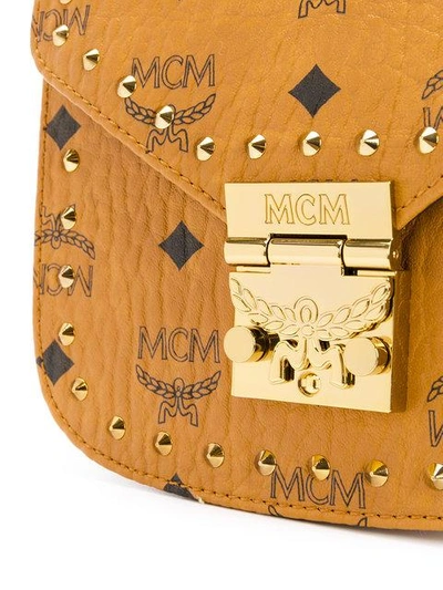 Shop Mcm Studded Saddle Crossbody Bag - Brown