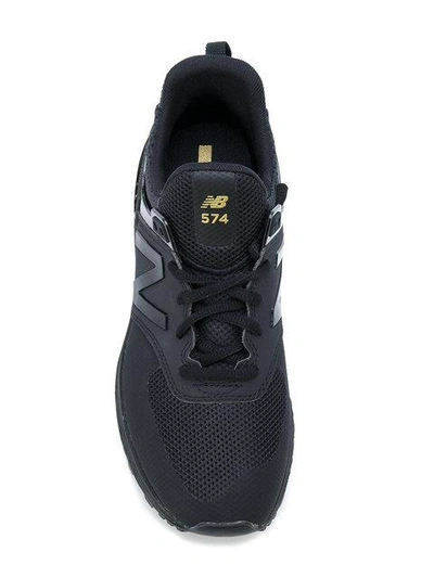 Shop New Balance 574 Sneakers