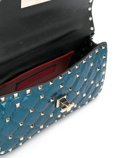 Shop Valentino Metallic Blue Rockstud Spike Small Cross Body Bag