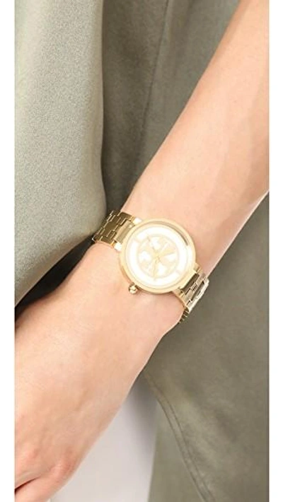 Shop Tory Burch The Reva Watch In Gold/ivory