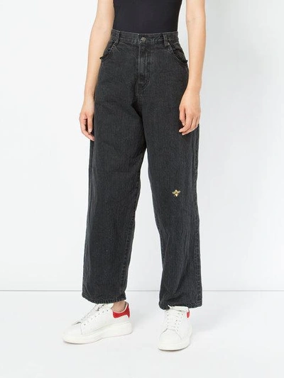 Shop Undercover Bee Embroidered Flared Jeans