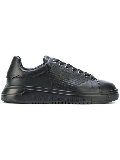 Shop Emporio Armani Embossed Logo Sneakers - Black