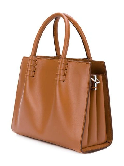 Shop Tod's Small Logo Embossed Tote - Brown