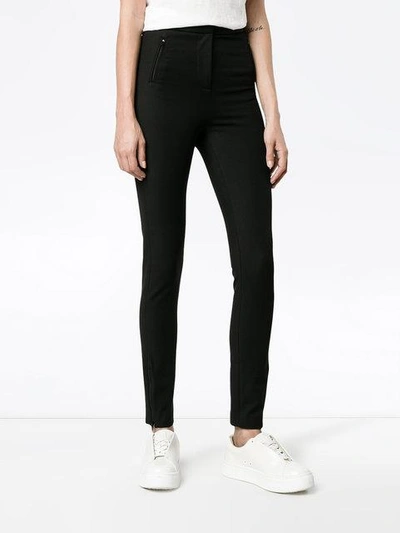 Shop Moncler Zipped Cuff Leggings In Black