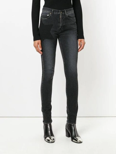 Shop Saint Laurent Star Skinny Jeans - Black