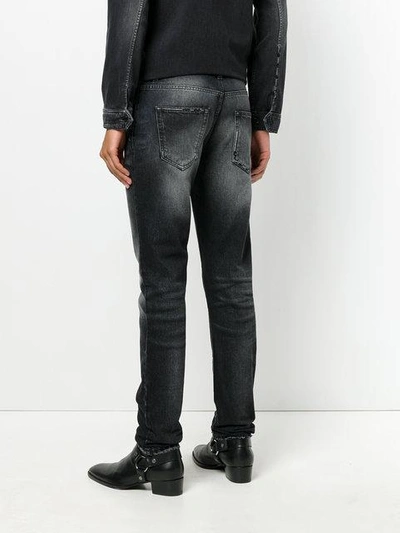 Shop Saint Laurent Distressed Trim Slim Fit Jeans In Black