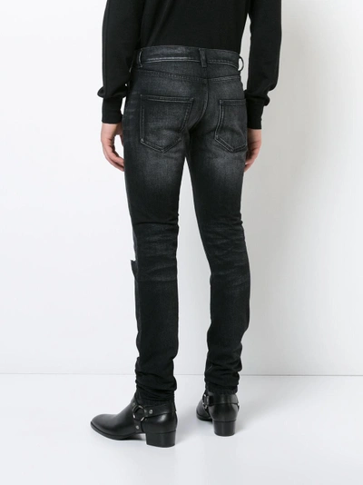 Shop Saint Laurent Slim-fit Knee Hole Jeans