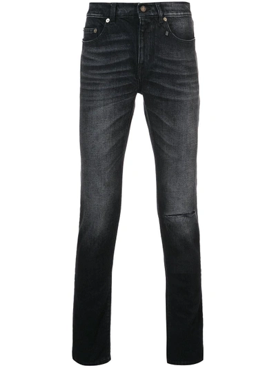 Shop Saint Laurent Slim-fit Knee Hole Jeans