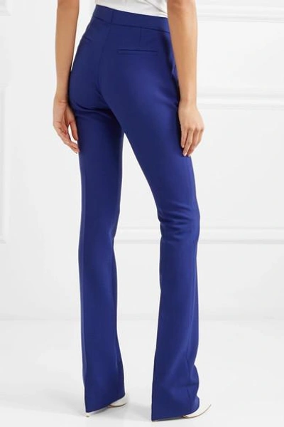 Shop Victoria Victoria Beckham Crepe Flared Pants In Indigo