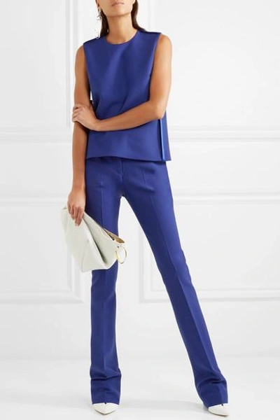 Shop Victoria Victoria Beckham Crepe Flared Pants In Indigo