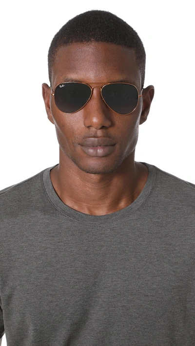 Shop Ray Ban Aviator Sunglasses In Bronze/grey