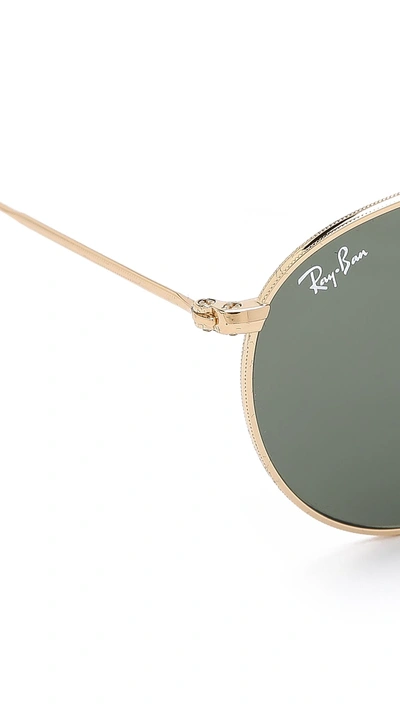 Shop Ray Ban Round Metal Sunglasses In Gold/green