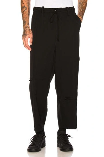 Shop Yohji Yamamoto Cross Zip Trousers In Black