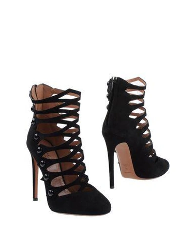 Shop Alaïa Ankle Boots In Black