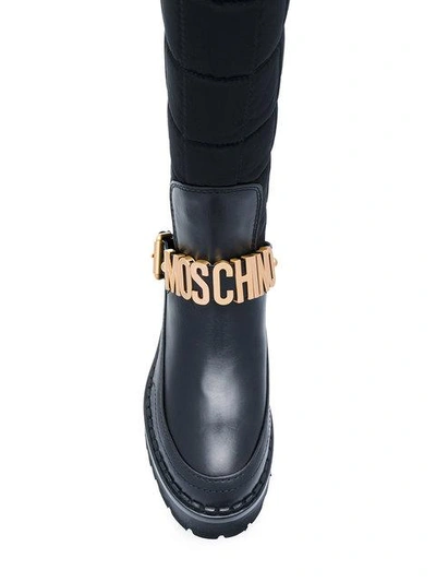 Shop Moschino Logo Buckle Boots In Black