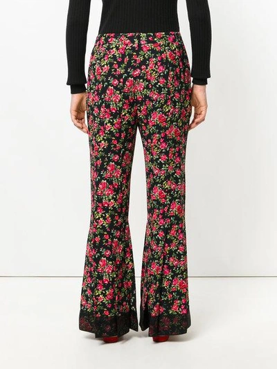 Shop Dolce & Gabbana Rose Print Flared Trousers - Black