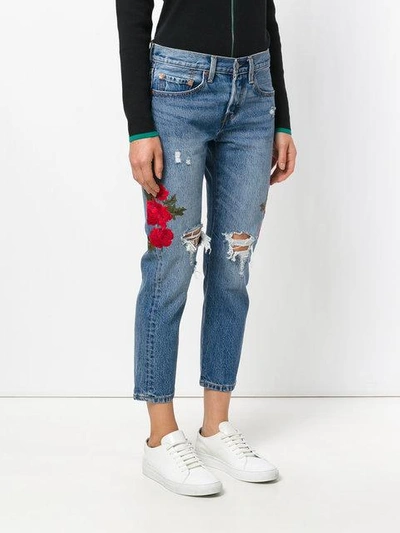 Shop Levi's Embroidered Distressed Cropped Jeans