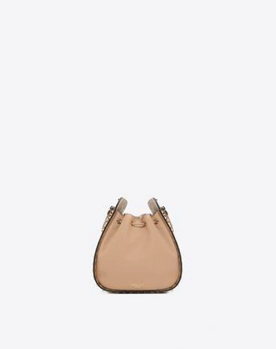 Shop Valentino Rockstud Small Bucket Bag In Skin Color