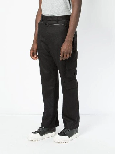 Shop Juunj Pinstripe Panel Trousers In Black