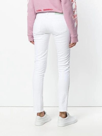 Shop Off-white Diag Strap Skinny Jeans In White