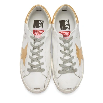 Shop Golden Goose White & Gold Superstar Sneakers